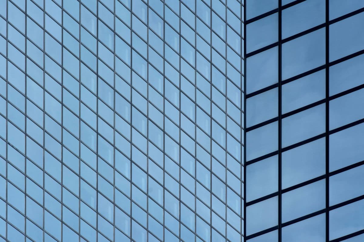 Modern commercial high-rise glass facade The full glass facade of a modern commercial high-rise tower